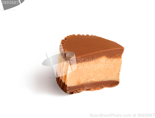 Image of Piece of chocolate cake with icing on white isolated background