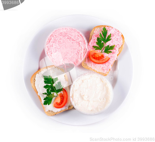 Image of two toasts with caviar on plate