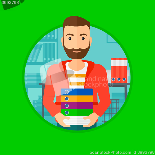 Image of Man holding pile of folders.