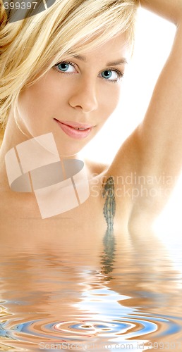 Image of friendly blonde in water