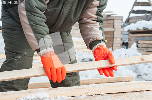 Image of Carpenter working at sawmill