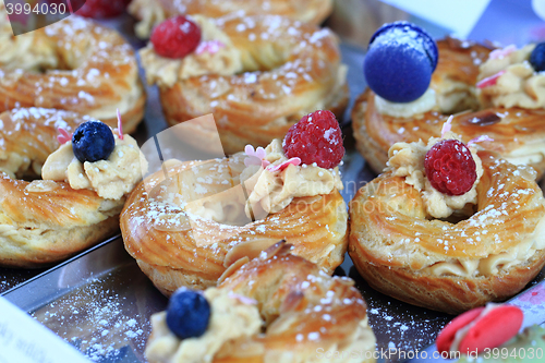 Image of cream puff with raspberries and blueberries