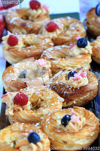 Image of cream puff with raspberries and blueberries