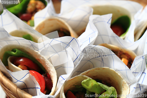 Image of tortilla with meat and beans