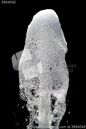 Image of water fountain isolated on the black background