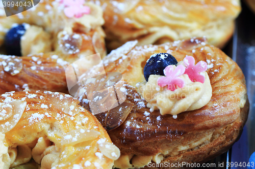 Image of cream puff with raspberries and blueberries