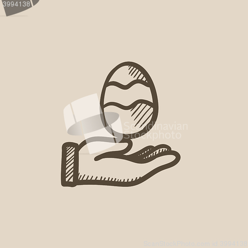 Image of Hand holding easter egg sketch icon.