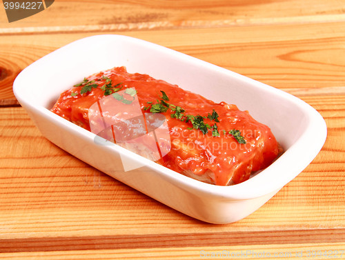 Image of red lasagna isolated on wooden background