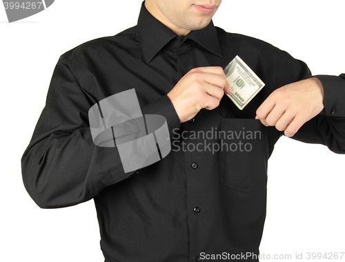 Image of Businessman putting money in shirts\' pocket