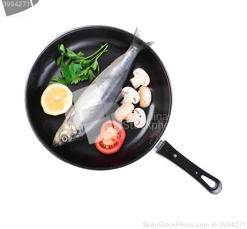 Image of fish in pan with vegetables