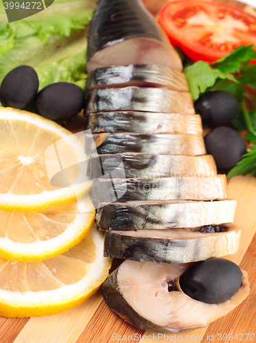 Image of sliced herring with vegetables