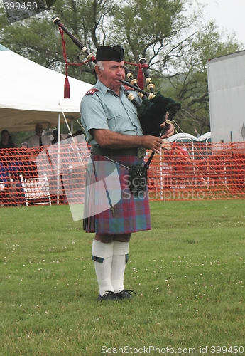 Image of A Scot Playing Pipes