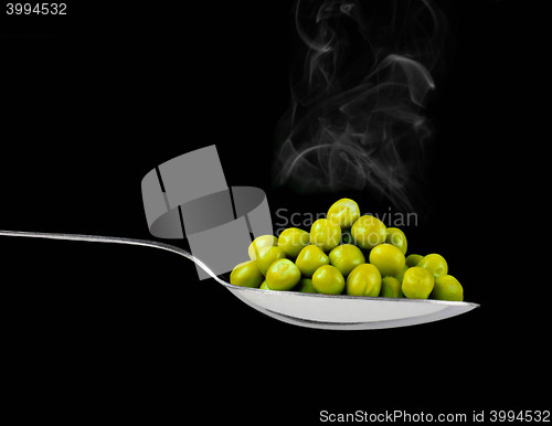 Image of fresh frozen peas on spoon