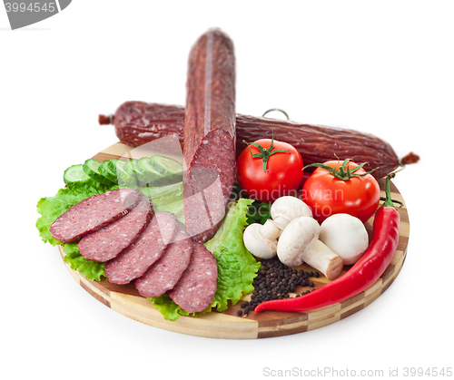 Image of sausages in coposition with vegetables