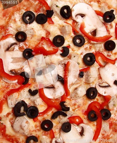 Image of Pepperoni pizza with mushrooms, shrimps and olives background