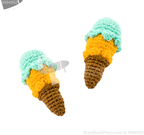 Image of two different flavor ice creams with cone on white