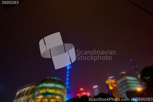 Image of Shanghai skyline at night out of focus. 