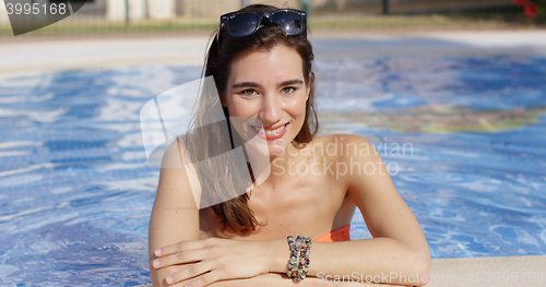 Image of Attractive trendy young woman in a swimming pool