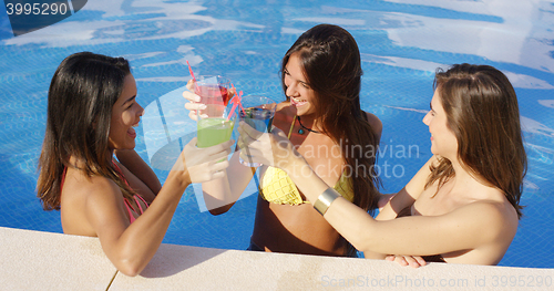 Image of Three happy female friends celebrating