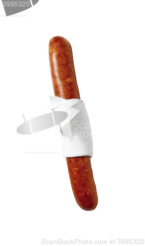 Image of close up of sausage in napkin