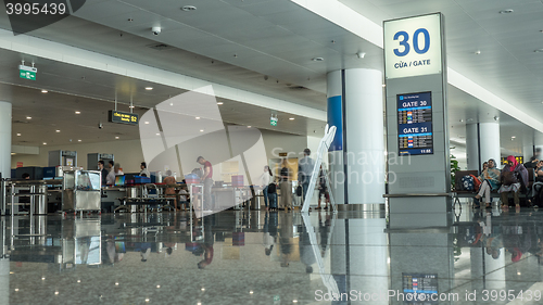 Image of Airport hall with people in security checkpoint. Hanoi, Vietnam