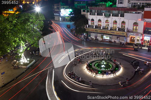 Image of Night traffic on the square with motion trails. Hanoi, Vietnam