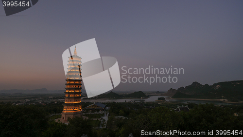 Image of Bai Dinh Temple with illuminated tower in the dusk, Vietnam