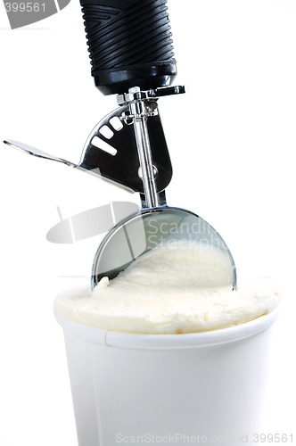 Image of Tub of vanilla ice cream with a scoop