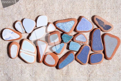 Image of pieces of colorful tiles polished by the sea 