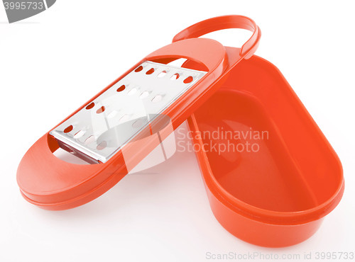 Image of Red grater isolated on white