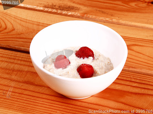 Image of Fresh strawberries in a glass dish on white background.