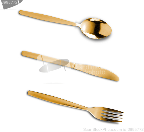 Image of The golden plug and knife isolated on white