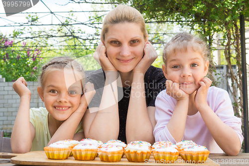 Image of Mother and two daughters have prepared Easter cupcakes