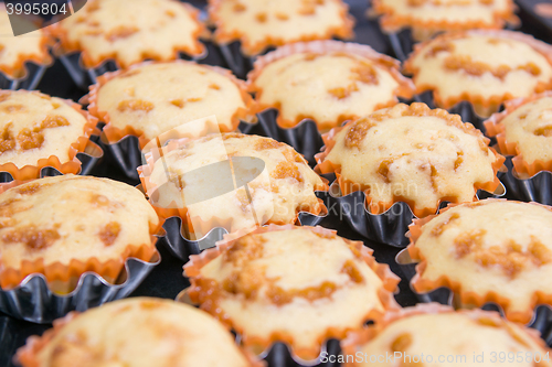 Image of Freshly baked muffins in metal tins