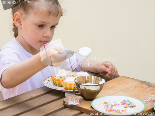 Image of Girl puts focus on confectionery glaze Easter cupcakes