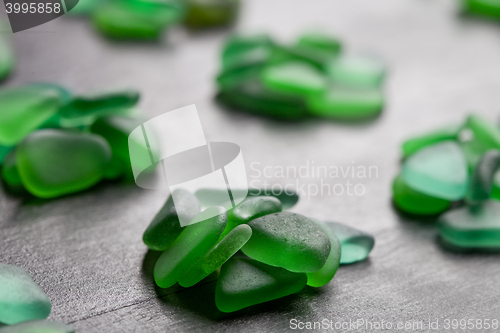 Image of green pieces of glass polished by the sea