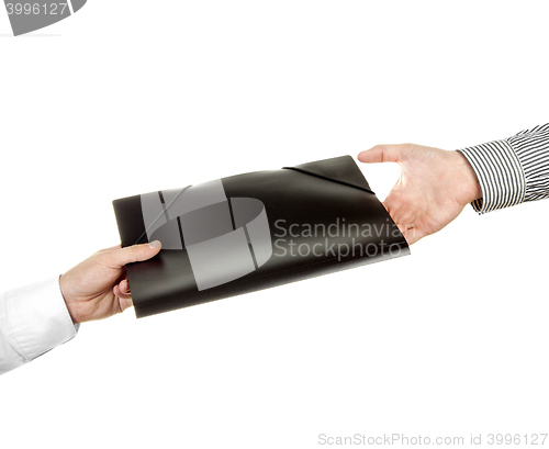 Image of Hand holding a folder