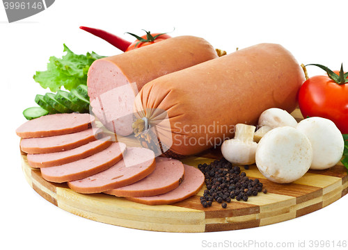 Image of sausage on plate with vegetables