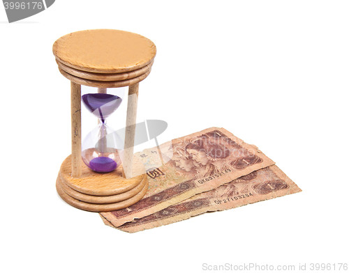 Image of Hour Glass with old money