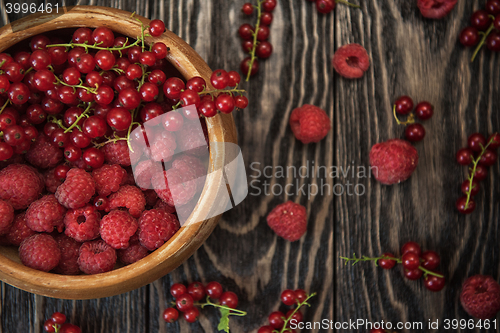 Image of Fresh berries on wooden table