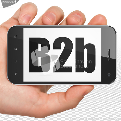 Image of Business concept: Hand Holding Smartphone with B2b on display