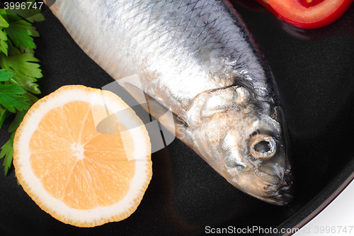 Image of fish on pan with lemon