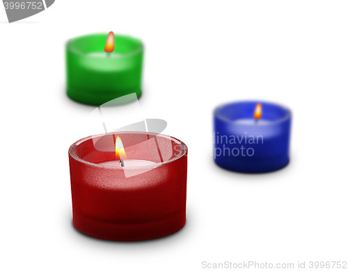 Image of three candles isolated on white