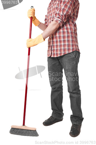 Image of young worker with a broom