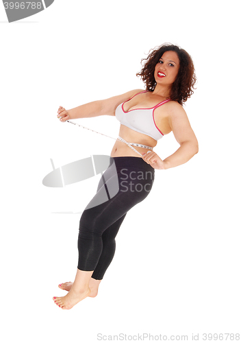 Image of Exercise woman measuring stomach.