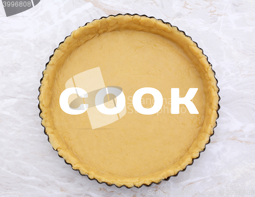 Image of Flan tin lined with shortcrust pastry - COOK text