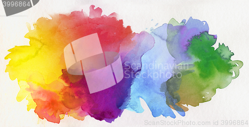 Image of rainbow colored watercolor paints on paper
