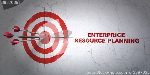 Image of Business concept: target and Enterprice Resource Planning on wall background