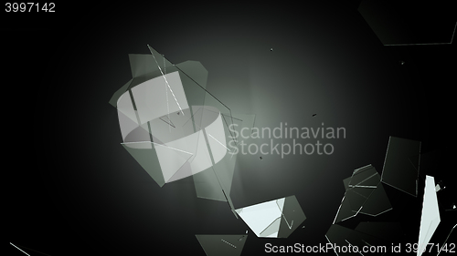 Image of Many pieces of shattered glass on black