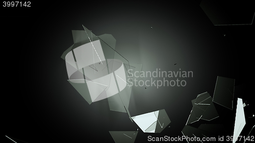 Image of Many pieces of shattered glass on black